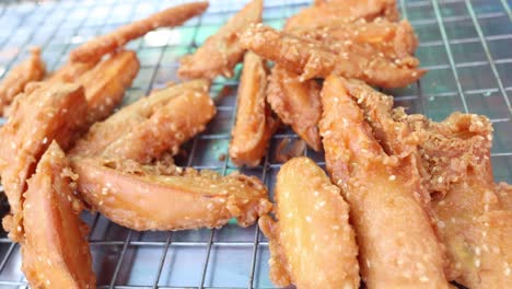 golden fried bananas resting on a wire rack.