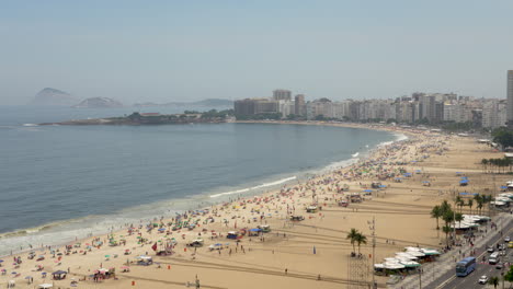 famous copacabana beach next to boulevard in rio de janeiro, brazil