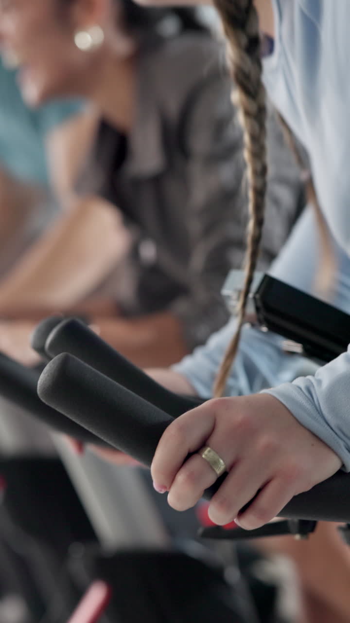 Close-up of Woman's Hands Cycling on Stationary Bike