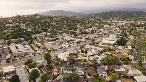 drone of suburban area near pasadena and glendale in los angeles with mountains in the distance