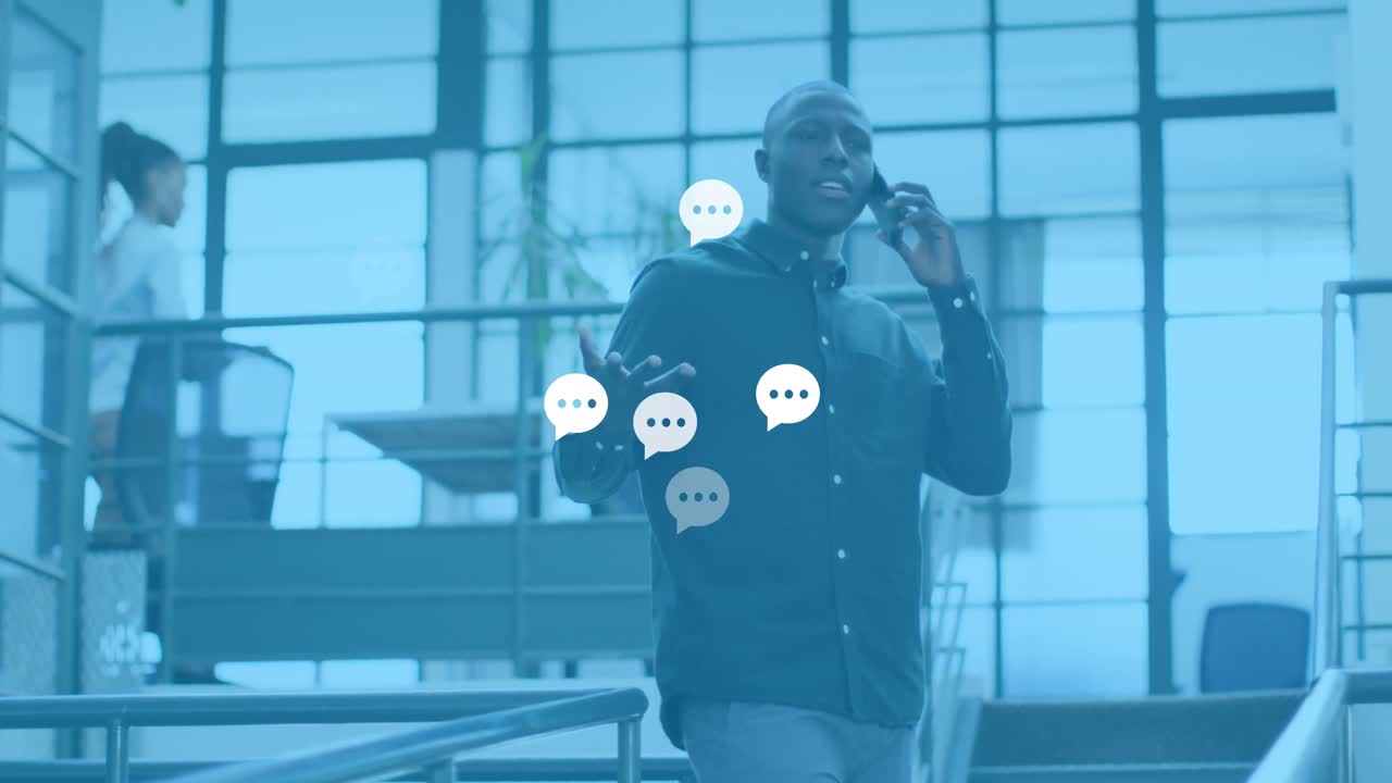Animation of social media reactions over african american man in office having call