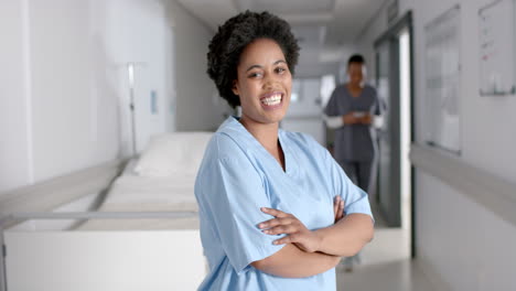 confident african american nurse stands in a hospital corridor