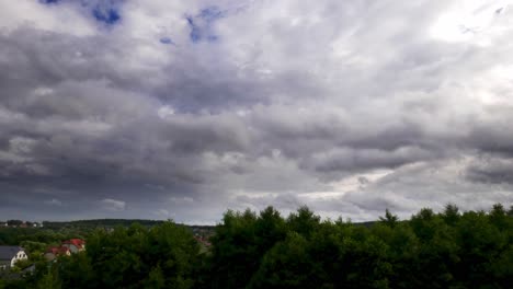 timelapse of rain clouds moving on a blue sky