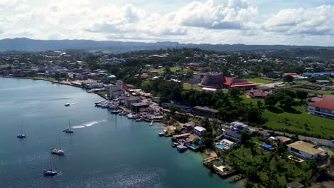 aerial drone landscape view of port vila harbour main town buildings wharf dock waterfront travel tourism pacific islands vanuatu 4k