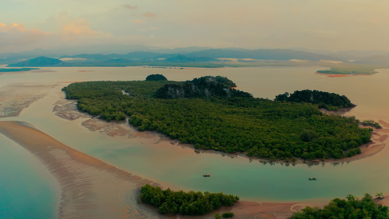 Aerial view of a tropical island with mangrove forests and calm waters