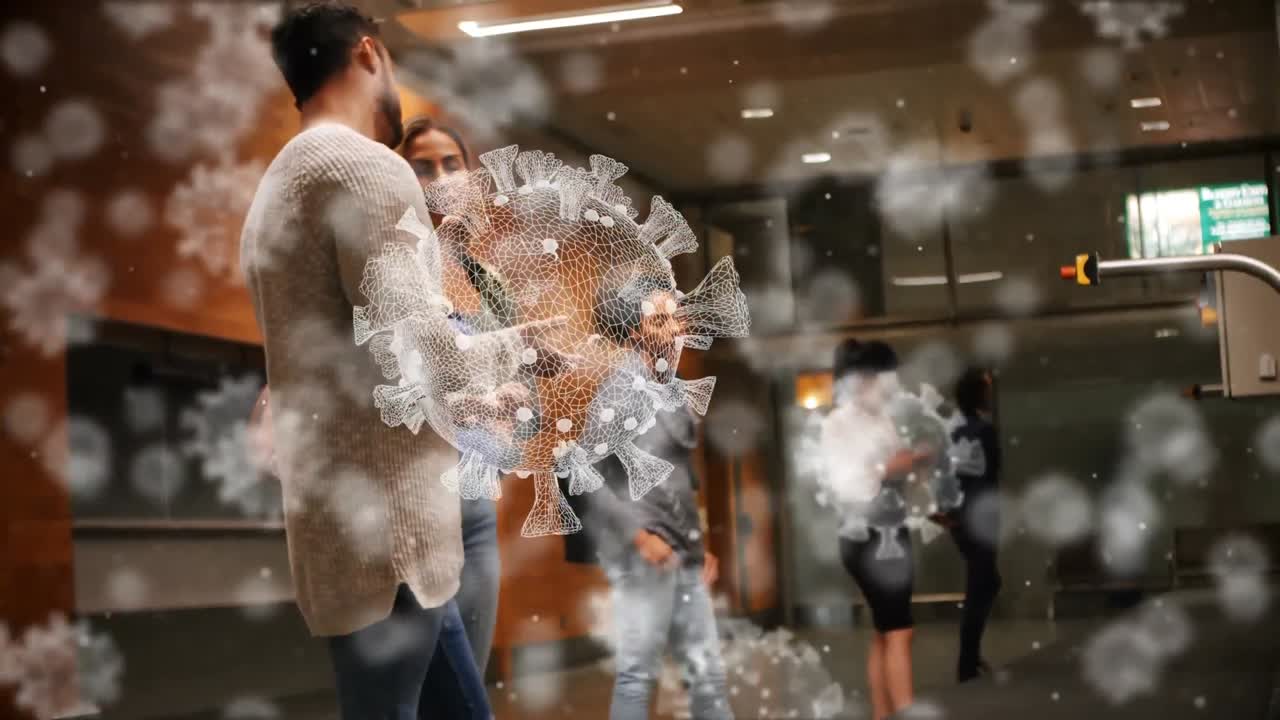 코로나19 세포가 백그라운드에서 여성과 대화하는 남자를 상대로 움직이는 디지털 복합 비디오