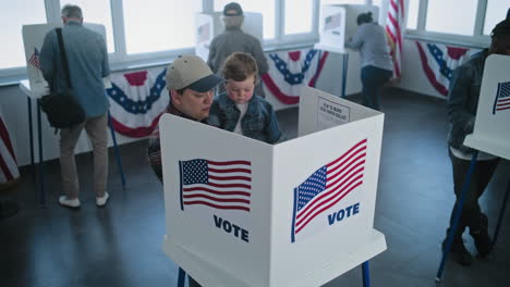 family voting at a polling place