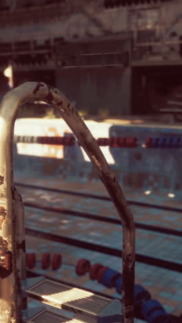 abandoned swimming pool with rusted ladder