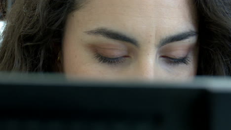 woman concentrating on a laptop