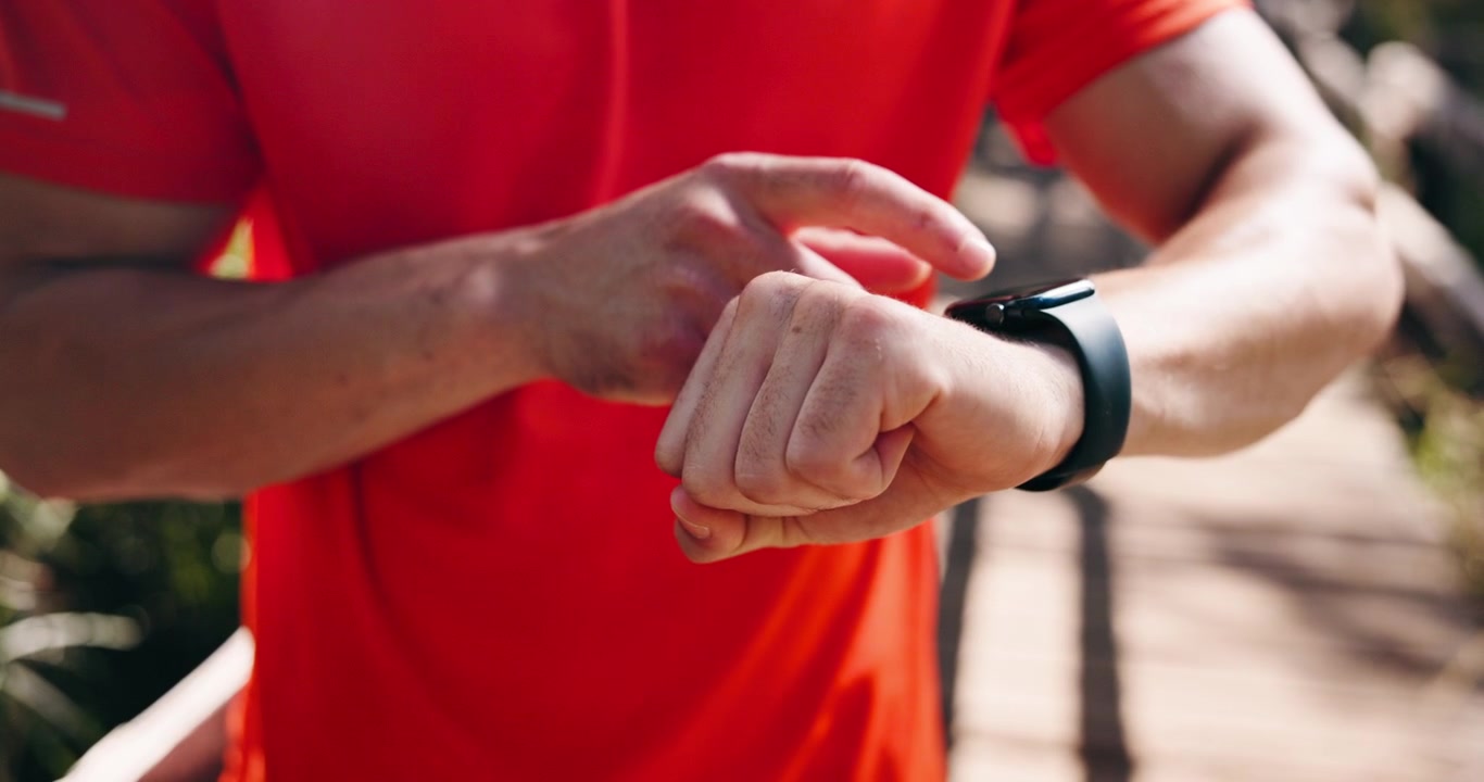 Athlete Checking Smartwatch During Outdoor Workout
