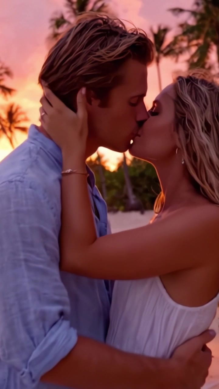 A Romantic Sunset Embrace: Two Lovers Share an Intimate Moment on the Beach as the Sky Glows in Shades of Orange and Pink, Highlighting the Beauty of their Connection