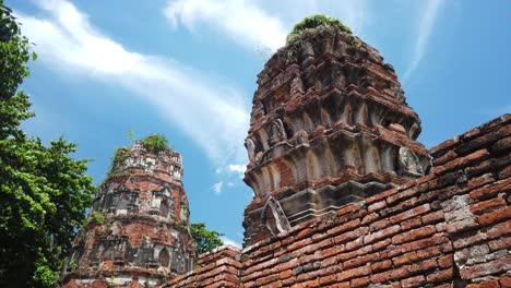 static shot: buddhist temple at the old the historic city of ayutthaya thailand with trees waiving