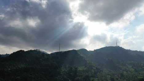 sunbeams breaking through clouds over mountains