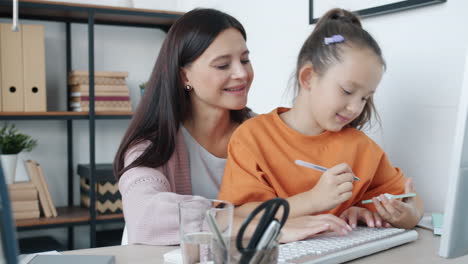 mother helping daughter with homework