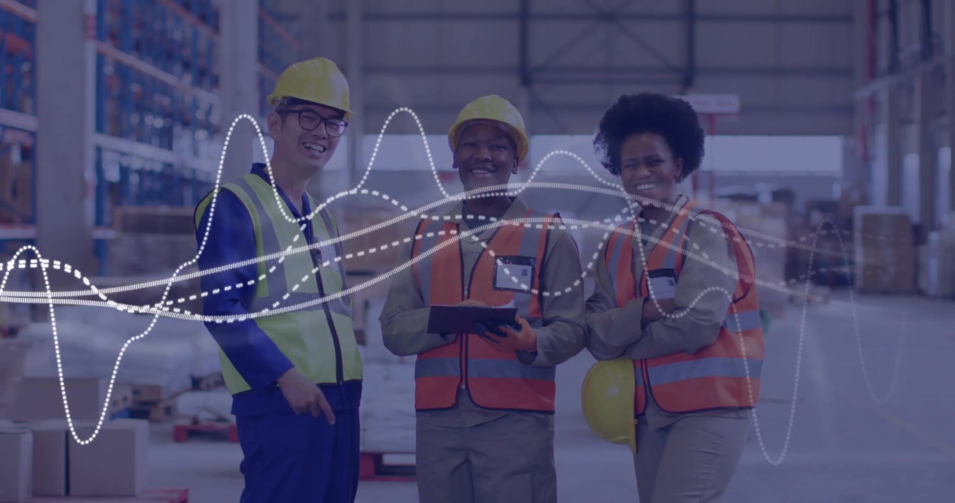 Warehouse team presenting tablet, reviewing inventory, causing waveform shifting across foreground
