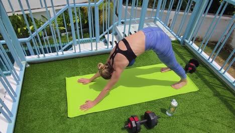 woman practicing yoga outdoors