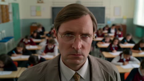 teacher supervising students during an exam