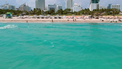 Beach-goers-play-in-water-out-of-focus