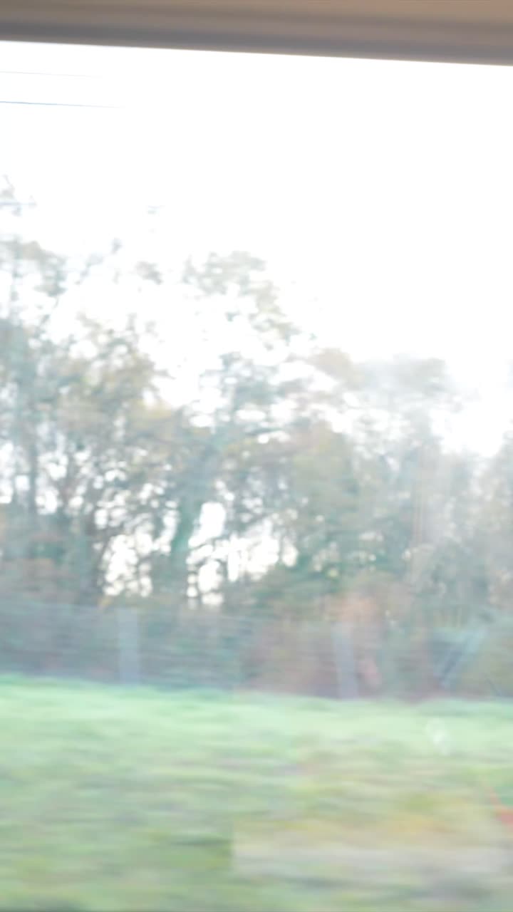 Man using Tablet and Headphones on Train