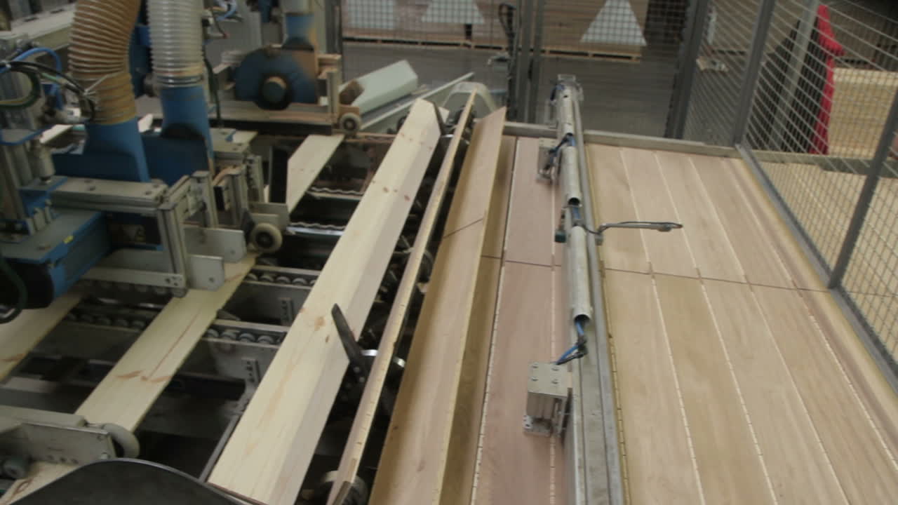 Floorboard Production In The Factory. Floorboard production in the industrial factory. Modern technologies.