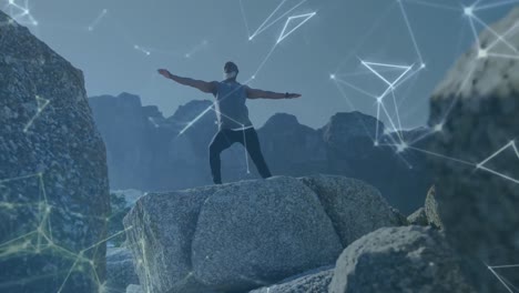 animation of network of connections over senior african american man practicing yoga at beach