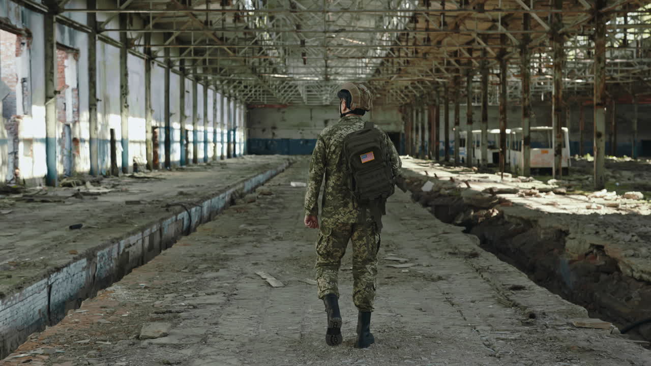 American Soldier in a Ruined Factory