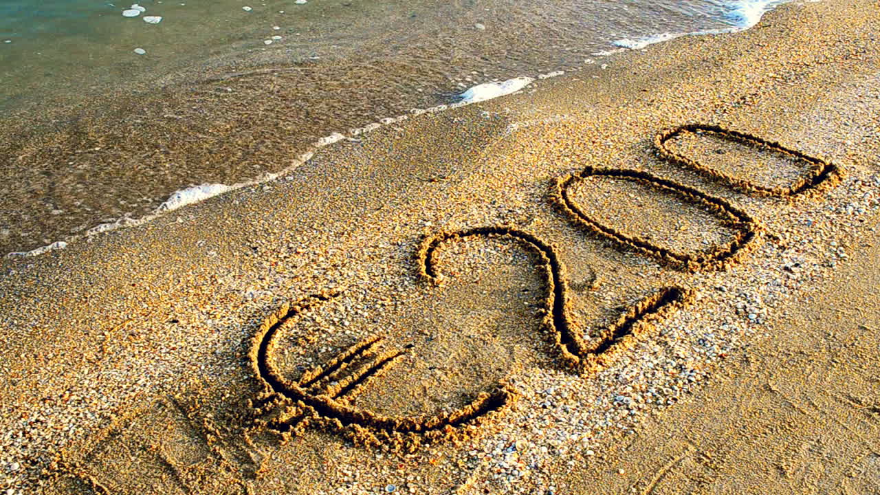 Inscription on the beach. Inscription of 200 euros