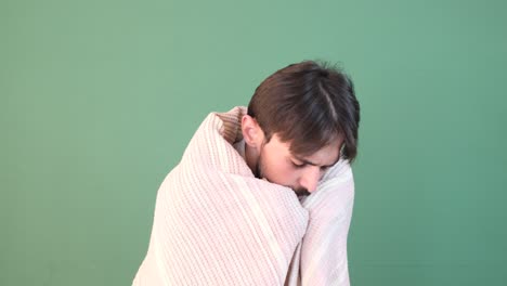 man blanket shivering with cold