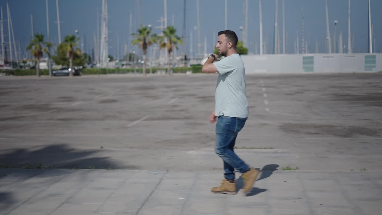 Man Walking in an Empty Parking Lot