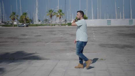 man walking in an empty parking lot
