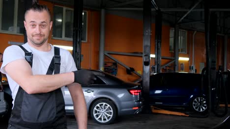 mechanic pointing in a car repair shop