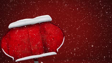 nieve cayendo sobre la nieve cubierta de señales rojas contra un fondo rojo