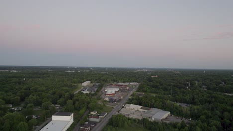 Aerial shot over small town during sunset