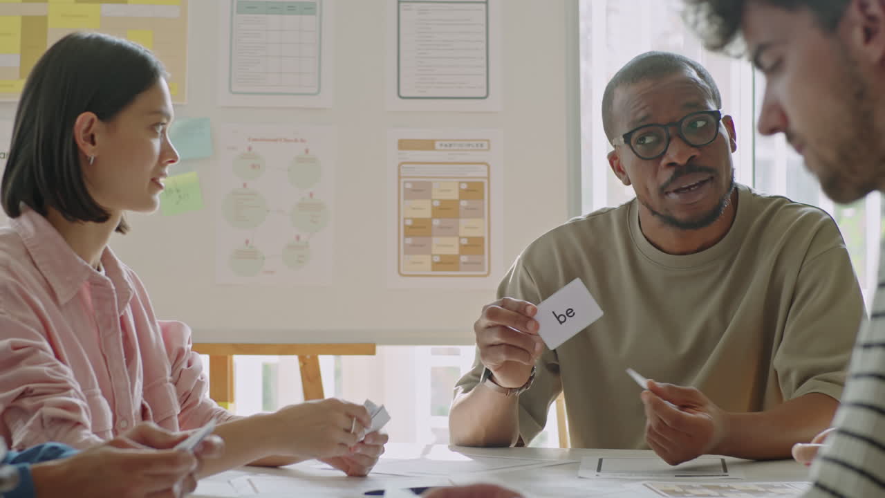 Black English Teacher Using Word Cards during Lesson