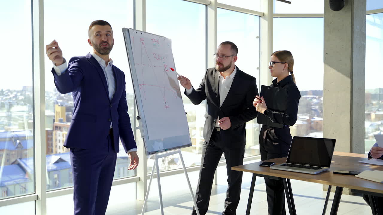 Conversation between business people. Group of successful entrepreneurs arguing in modern office room with large windows in the city.