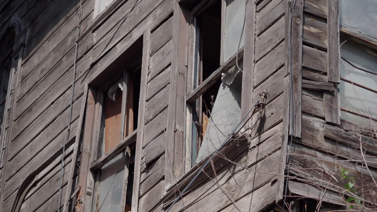Dilapidated Wooden Building with Broken Windows