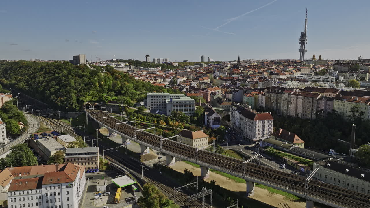 Prague Czechia Aerial v51 drone flyover Florenc neighborhood capturing central transportation hub, V&iacute;tkov hill and Zizkov cityscape featuring TV tower - Shot with Mavic 3 Cine - November 2022