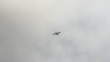 airplane in the air with clouds and smoke