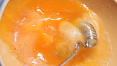 whisk eggs in bowl for cooking