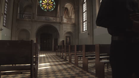 african-american priest going along church