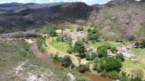 aerial drone of luxury villa structure with mountains in background