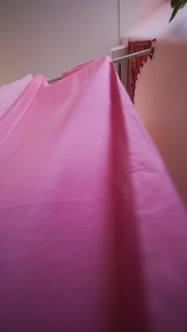 woman wearing dress in pink room