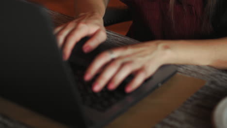 Cropped shot view of young smart female student learning on-line via laptop computer before her lectures, intelligent woman sitting in front open net-book with copy space screen for your text message