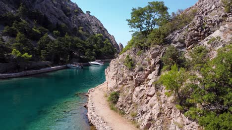 Beautiful-reveal-of-Zavratnica-Inlet,-popular-swimming-spot-and-scenic-coastal-landscape