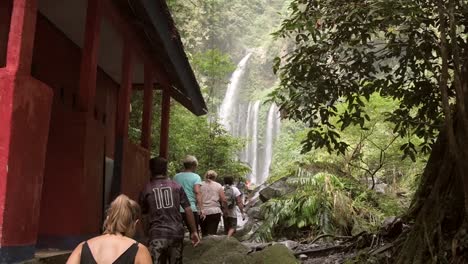 people lining up to see a waterfall