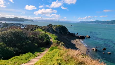 scenic panoramic landscape view overlooking wellington harbour ocean and islands from top of rugged hills and cliffs in capital city of new zealand aotearoa