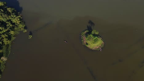 aerial birds eye view of small island surrounded by floodwater in sylhet