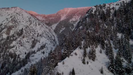 snowy mountain turning flyover at golden hour, salt lake city, ut