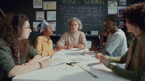 teacher and group of students having discussion on english lesson