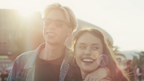 Caucasian-couple-having-fun-on-music-festival-together.